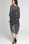 Model wearing black chiffon kimono with hearts & circle shapes facing back